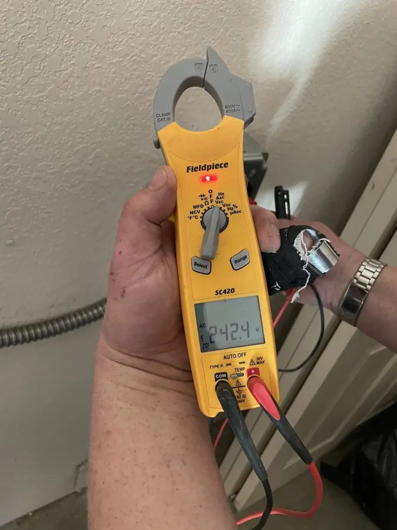 Voltage testing with clamp meter during Hot Tub / Pool Electrical Wiring in Wallington